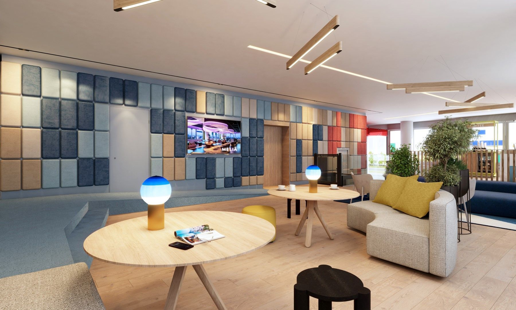 Contemporary lifestyle hotel in Germany with an urban lobby, colorful design details, flexible seating, and a relaxed atmosphere for young professionals.