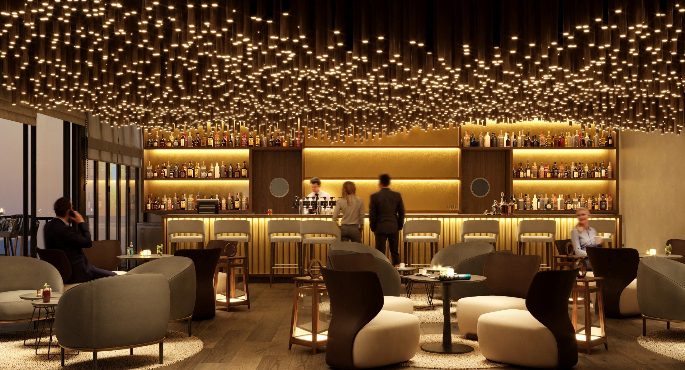 Hotel rooftop bar in Oman with warm lighting, elegant lounge seating, and a refined evening atmosphere.